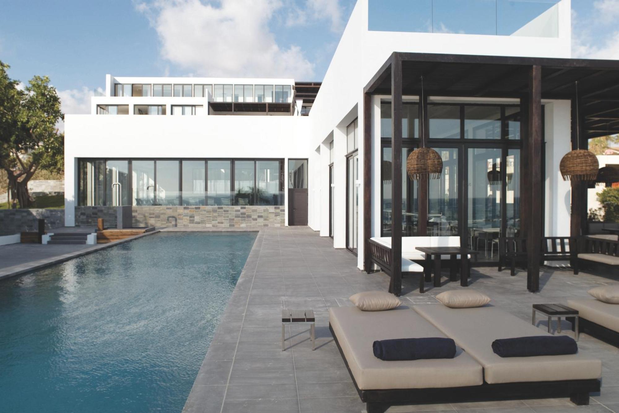 Almyra Hotel Пафос Екстериор снимка The hotel's pool